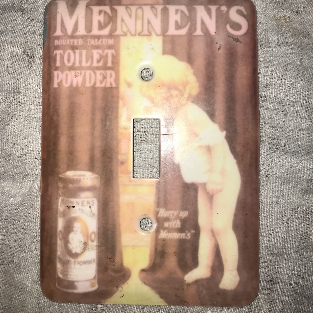 Mennen’s antique advertisement light switch cover